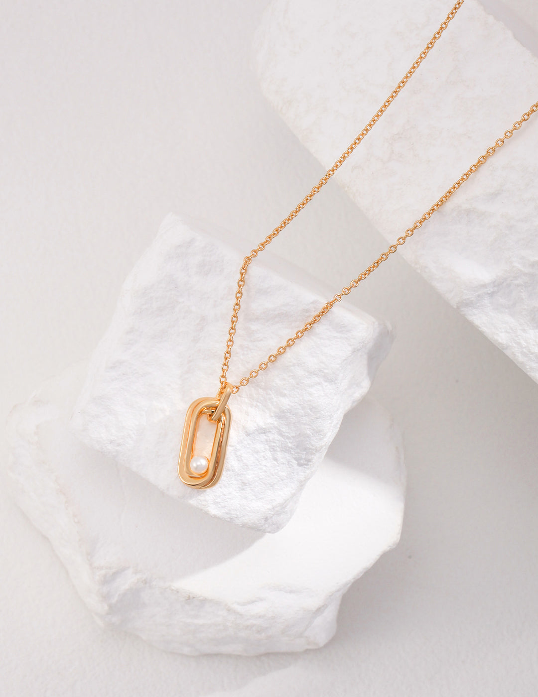 Sterling Silver Pearl Necklace with Twisted Möbius Oval Design