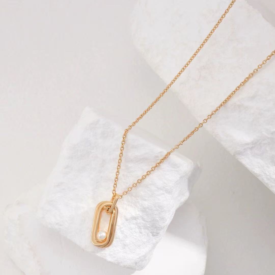 Sterling Silver Pearl Necklace with Twisted Möbius Oval Design