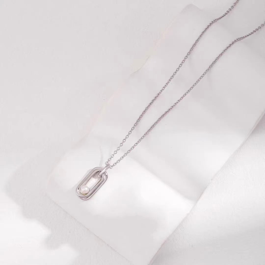 Sterling Silver Pearl Necklace with Twisted Möbius Oval Design